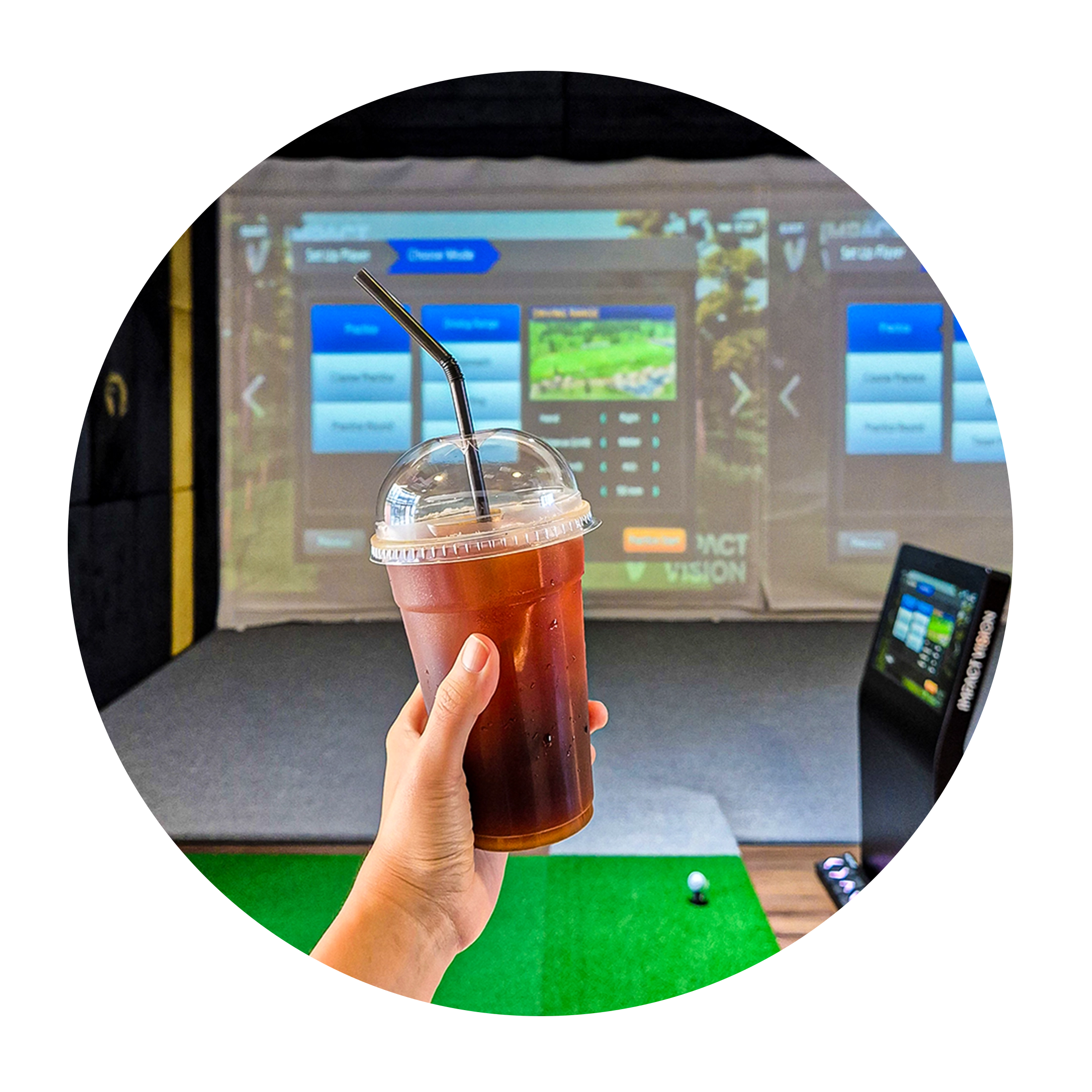 Beverage in hand while at a virtual golf driving range.